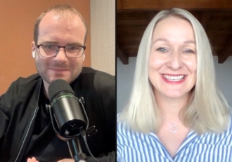 Split-screen video call: a man with glasses and a microphone on the left, and a smiling blonde woman in a striped blue shirt on the right.